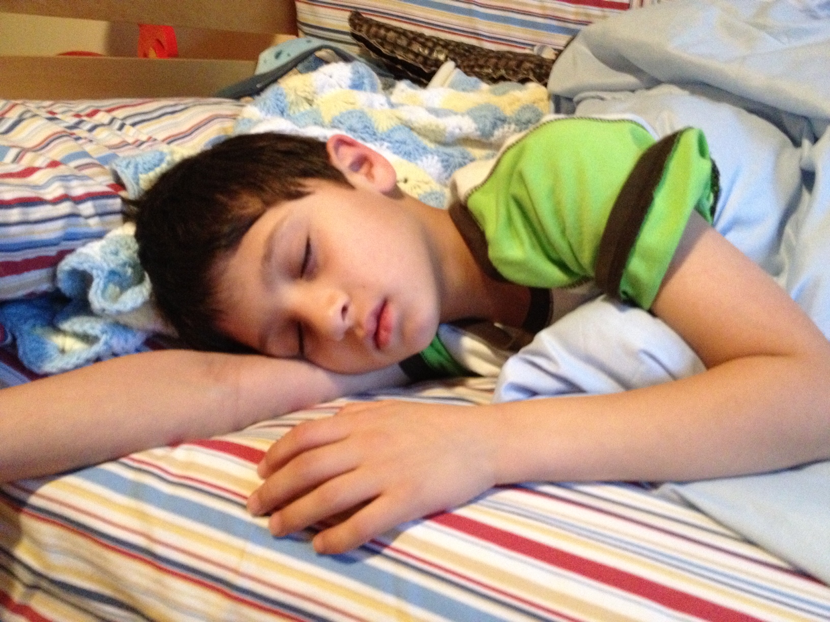 Photo of a young boy, sleeping.