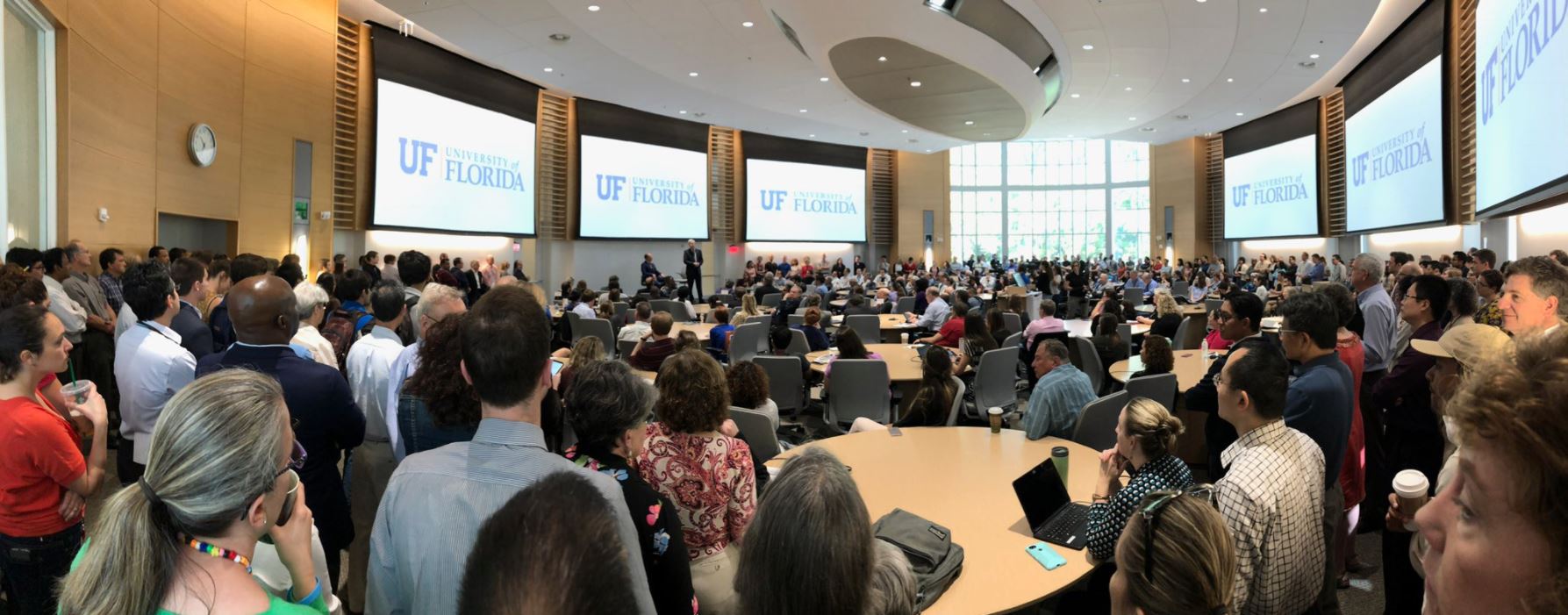Francis Collins addresses a packed conference hall at the University of Florida