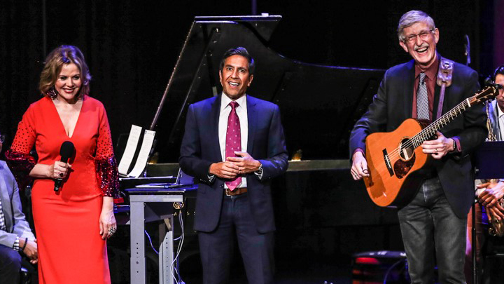 Dr. Francis Collins laughs on stage with Renee Fleming and Dr. Sanjay Gupta