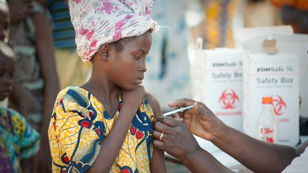 Young girl getting immunized