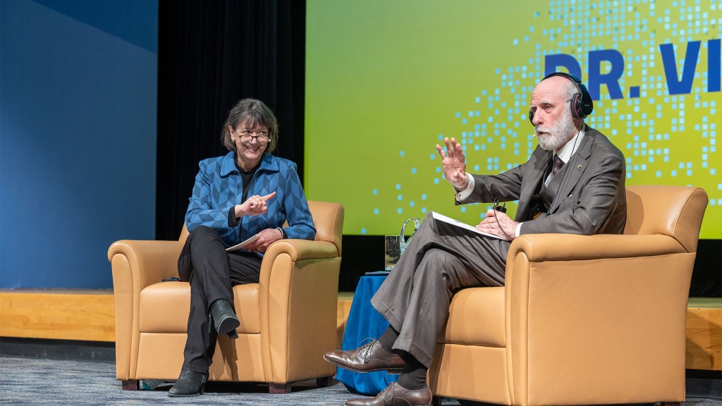 Director Bertagnolli and Vint Cerf sitting in chairs on stage